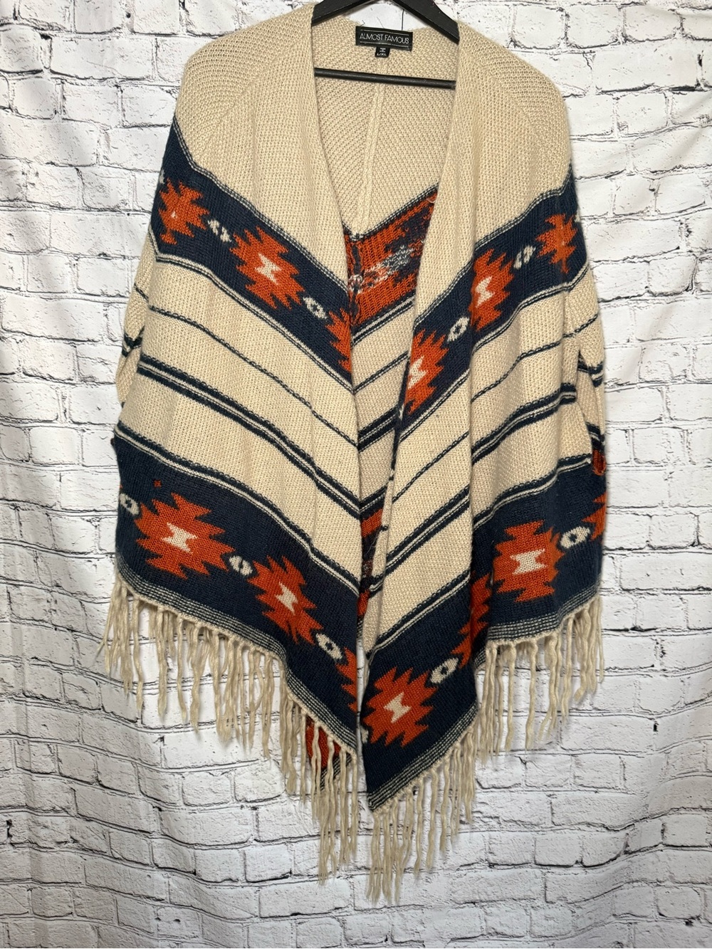 Almost famous. Tan poncho. Size L/XL
